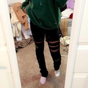 Small black ripped stacked sweatpants